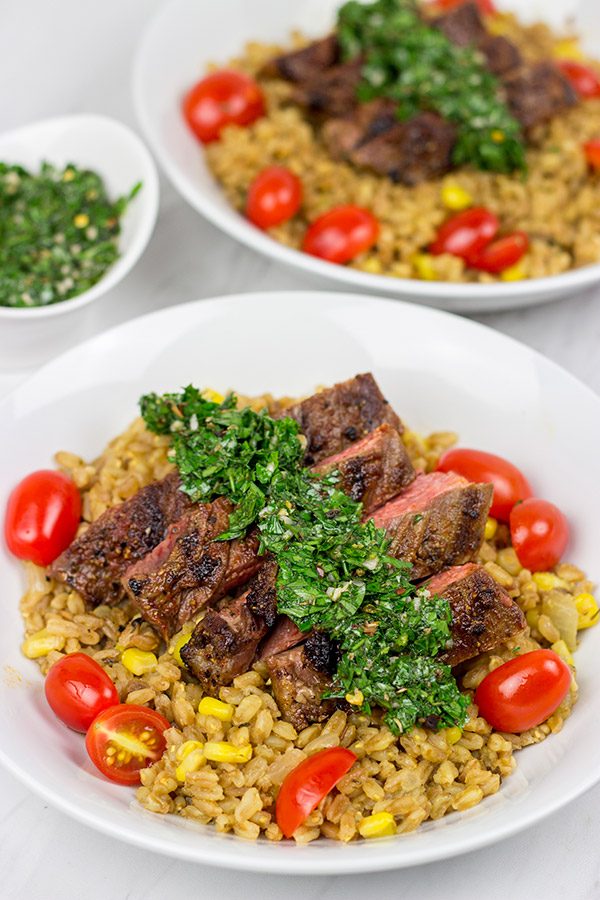 Looking for a delicious summer meal? This Grilled Flank Steak with Porcini Mushroom Pilaf will make you look like a superstar chef!