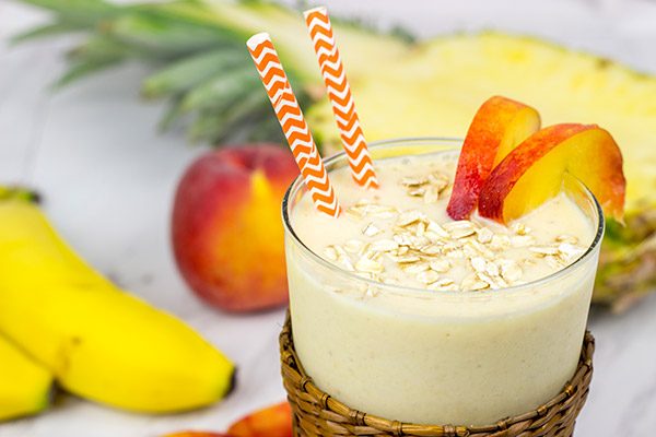 This Pineapple Peach Oatmeal Smoothie includes toasted oats for an extra layer of flavor. It's perfect for warm summer days!