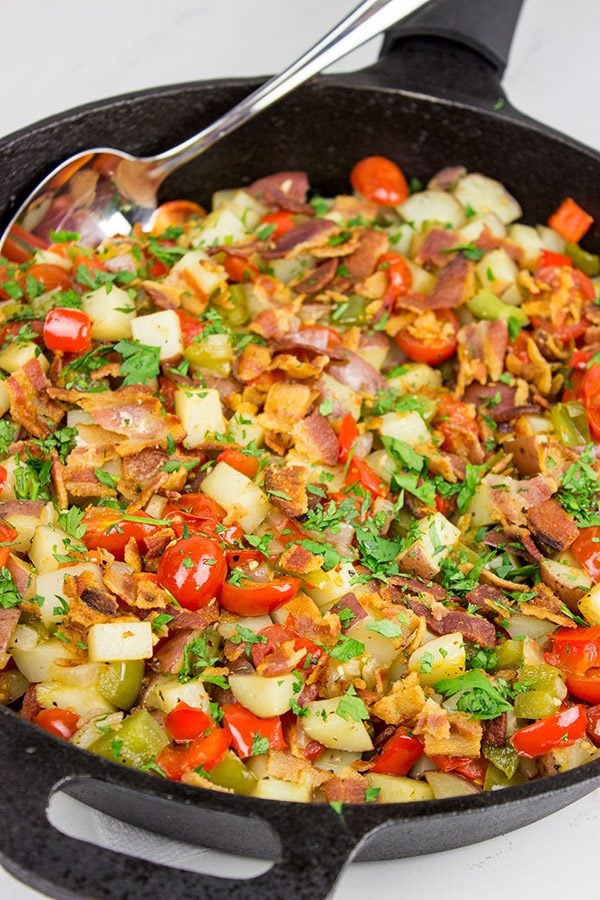 Pull out that cast iron skillet and whip up a batch of these Skillet Potatoes with Bacon and Cherry Tomatoes!
