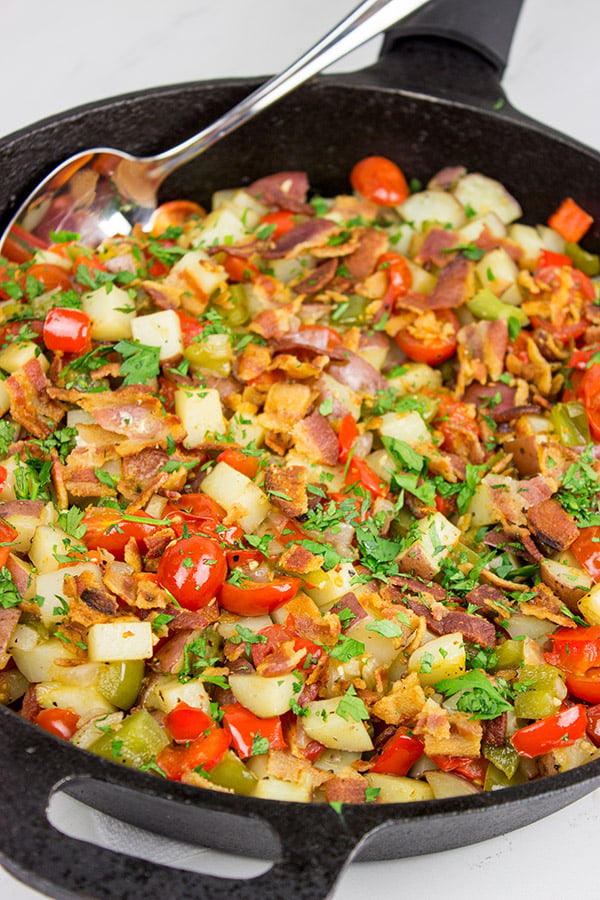 Pull out that cast iron skillet and whip up a batch of these Skillet Potatoes with Bacon and Cherry Tomatoes!