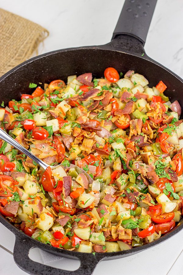 Pull out that cast iron skillet and whip up a batch of these Skillet Potatoes with Bacon and Cherry Tomatoes!