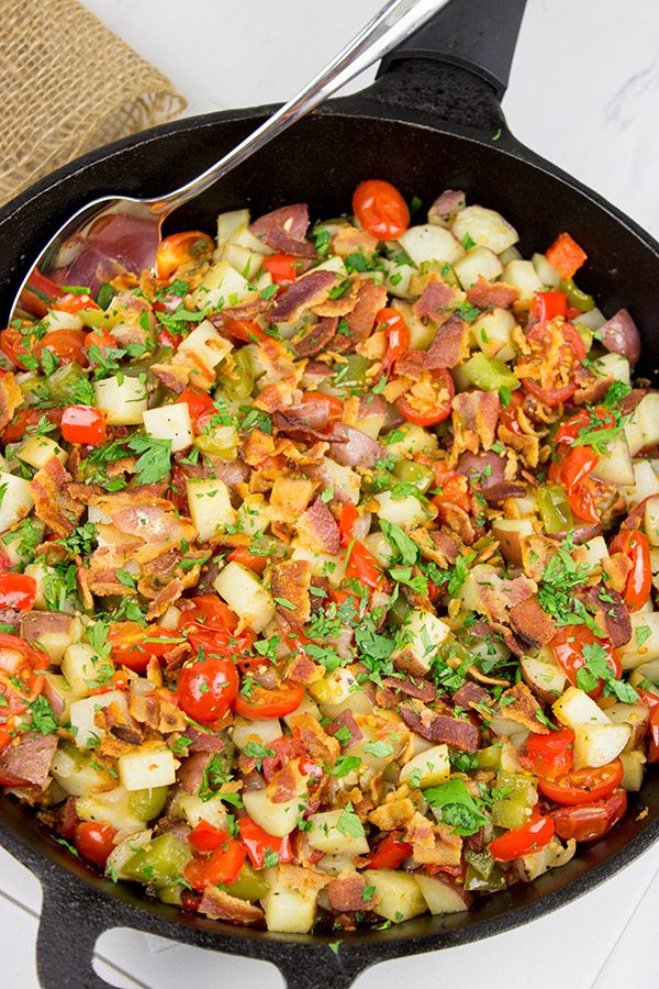 Pull out that cast iron skillet and whip up a batch of these Skillet Potatoes with Bacon and Cherry Tomatoes!