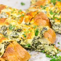 This Spinach Artichoke Stuffed French Bread is a tasty appetizer to serve while watching your favorite sport on tv!
