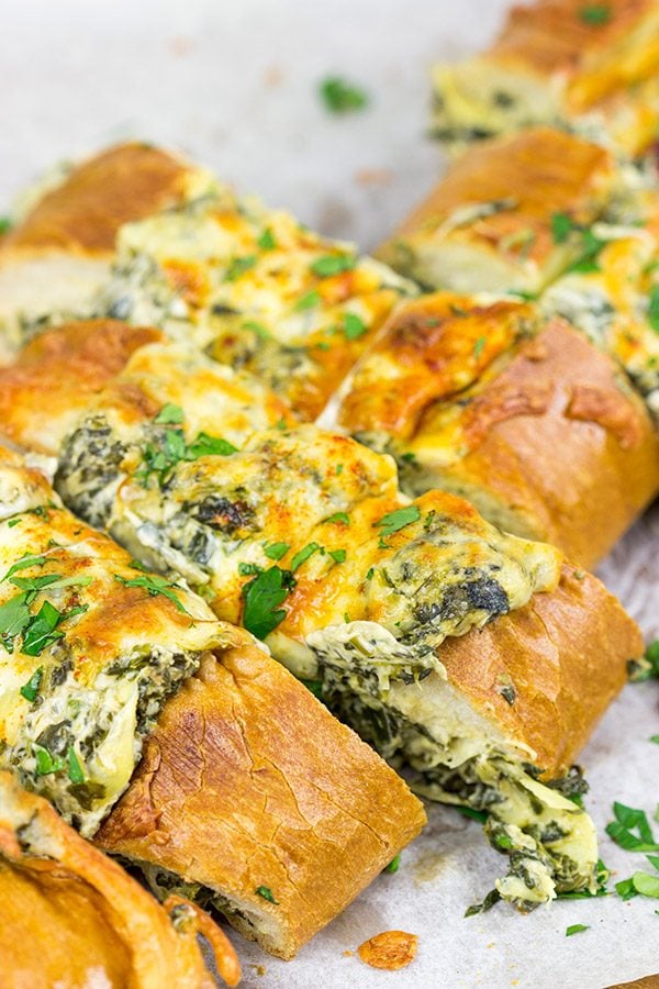 This Spinach Artichoke Stuffed French Bread is a tasty appetizer to serve while watching your favorite sport on tv!