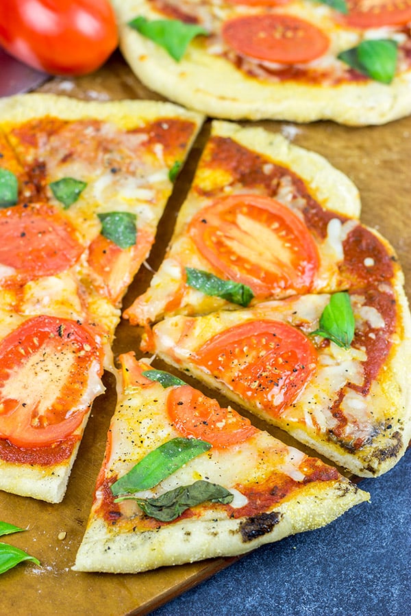 It's summer! Fire up the grill and make this Grilled Tomato Basil Pizza for dinner this weekend!