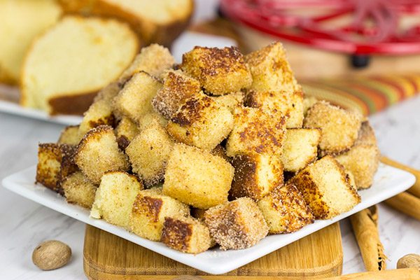 Take one fashioned pound cake.  Cut it into bites and then toss it in classic Autumn spices.  Oh yeah, these Pumpkin Spice Pound Cake Bites are quite tasty!