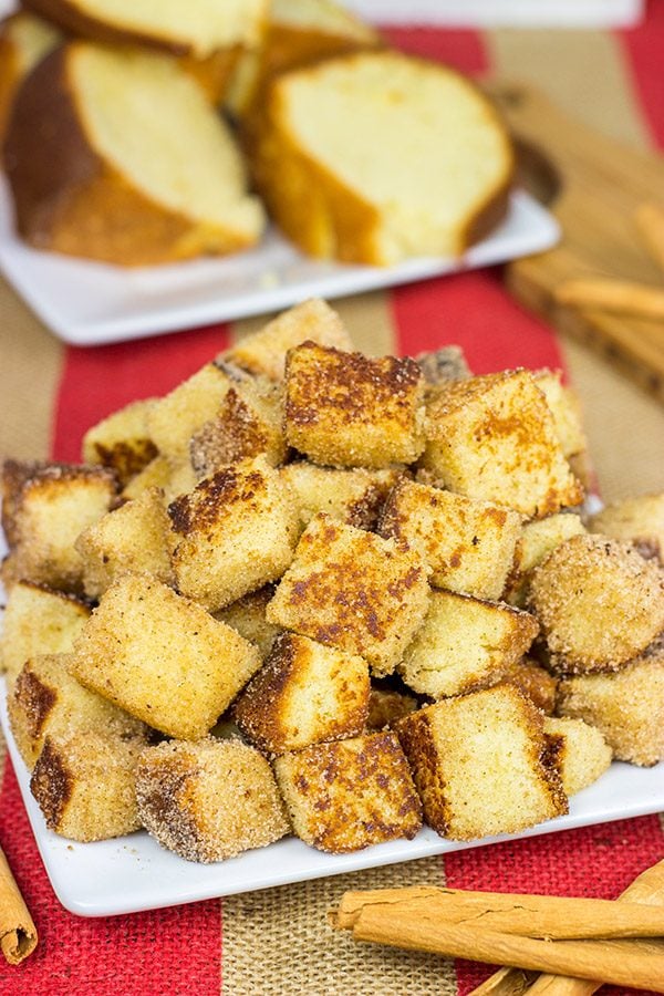 Take one fashioned pound cake.  Cut it into bites and then toss it in classic Autumn spices.  Oh yeah, these Pumpkin Spice Pound Cake Bites are quite tasty!