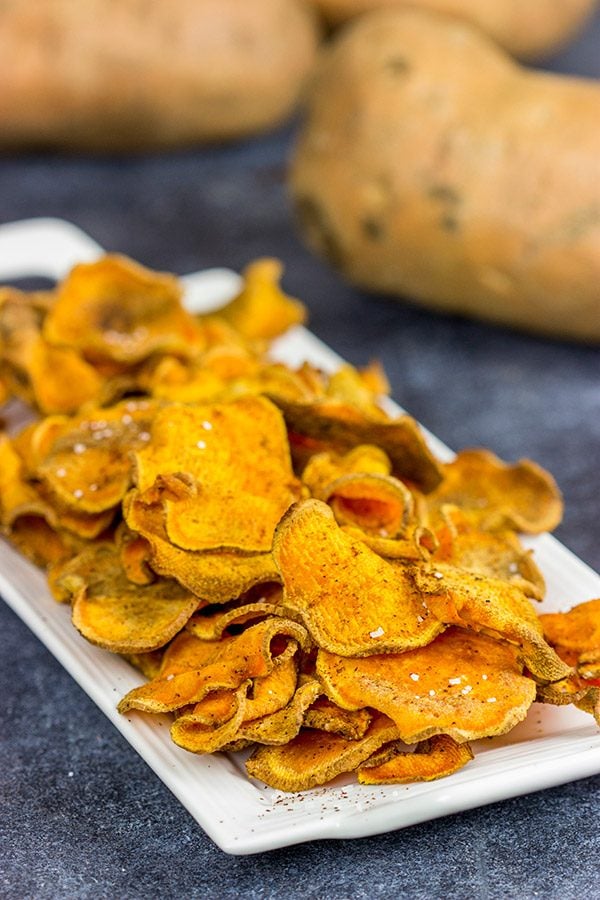 Looking for a fun snack idea? These Spicy Baked Sweet Potato Chips are sure to be a hit!