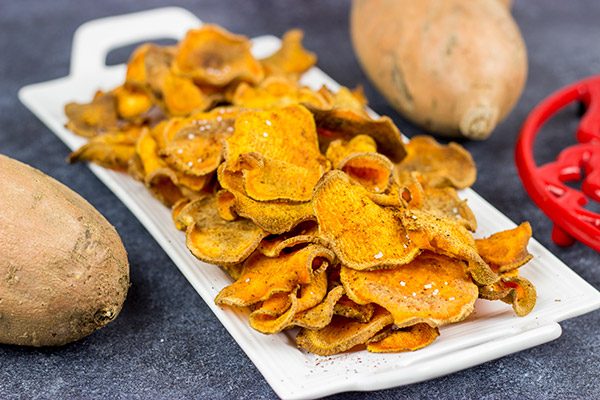 Looking for a fun snack idea? These Spicy Baked Sweet Potato Chips are sure to be a hit!