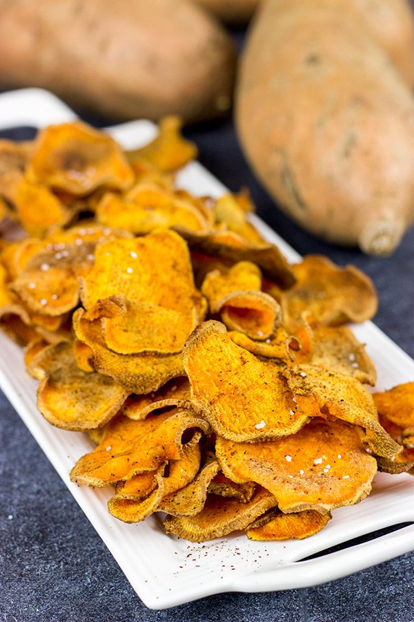 Looking for a fun snack idea? These Spicy Baked Sweet Potato Chips are sure to be a hit!