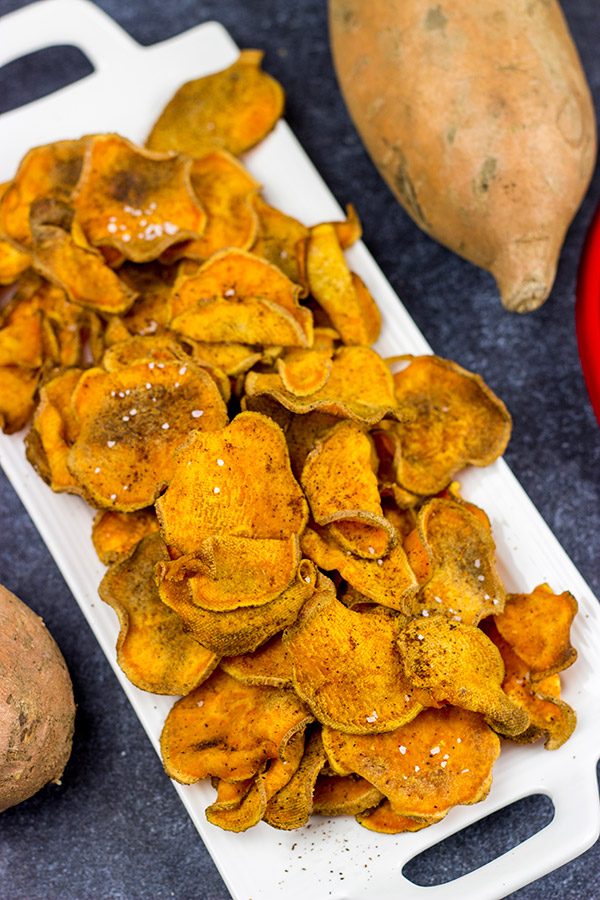 Looking for a fun snack idea? These Spicy Baked Sweet Potato Chips are sure to be a hit!