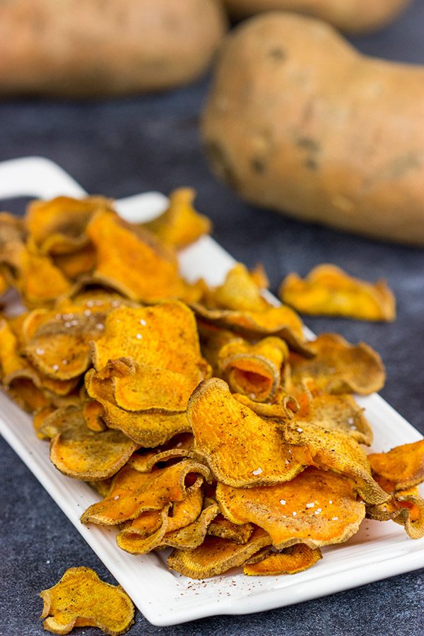 Looking for a fun snack idea? These Spicy Baked Sweet Potato Chips are sure to be a hit!