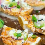 These Buffalo Chicken Breadsticks make an excellent football appetizer!  Grab a loaf of French bread and top it with spicy buffalo chicken, creamy blue cheese and melty mozzarella!
