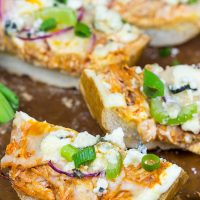 These Buffalo Chicken Breadsticks make an excellent football appetizer! Grab a loaf of French bread and top it with spicy buffalo chicken, creamy blue cheese and melty mozzarella!