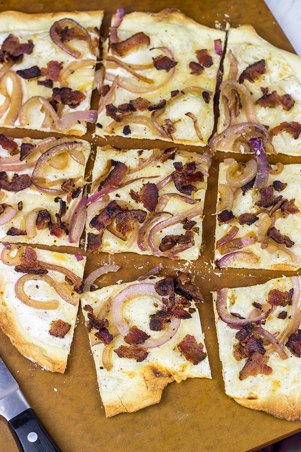 Flammkuchen, or tarte flambée in French, is a German-style thin-crust "pizza" topped with bacon and onions...and it's delicious!