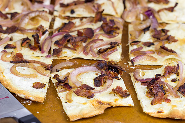 Flammkuchen, or tarte flambée in French, is a German-style thin-crust "pizza" topped with bacon and onions...and it's delicious!