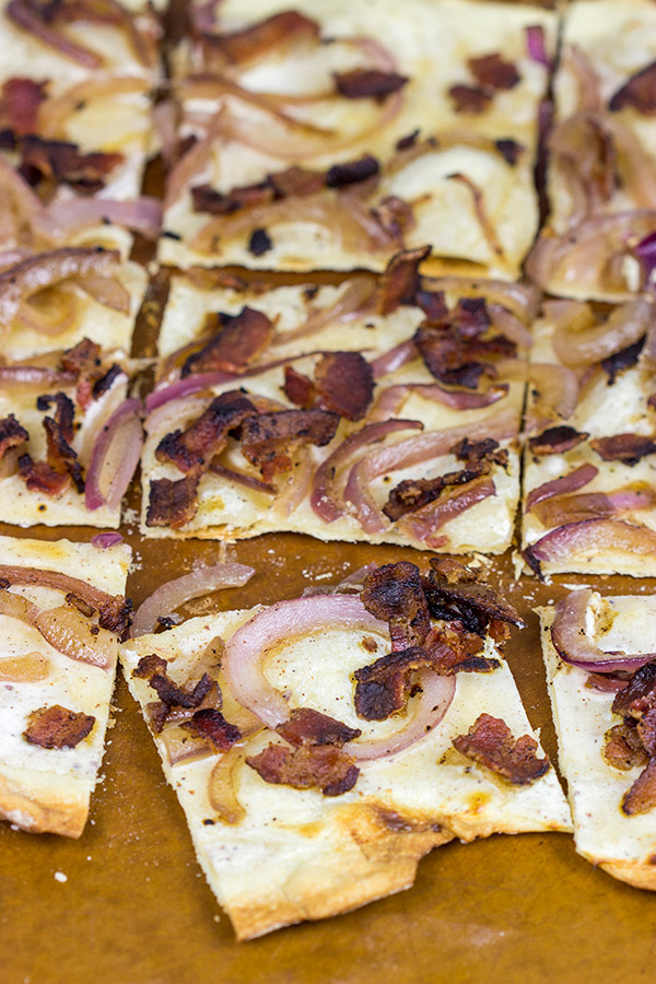 Flammkuchen, or tarte flambée in French, is a German-style thin-crust "pizza" topped with bacon and onions...and it's delicious!