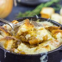 This classic French Onion Soup includes flavorful broth topped with toasted sourdough croutons and plenty of melted cheese! It's the perfect fare for cold winter evenings!