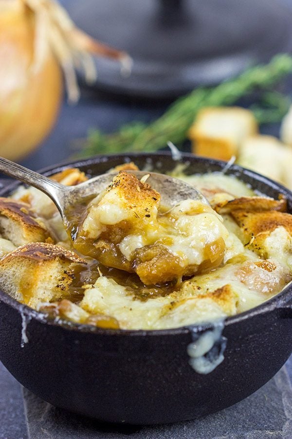 This classic French Onion Soup includes flavorful broth topped with toasted sourdough croutons and plenty of melted cheese! It's the perfect fare for cold winter evenings!