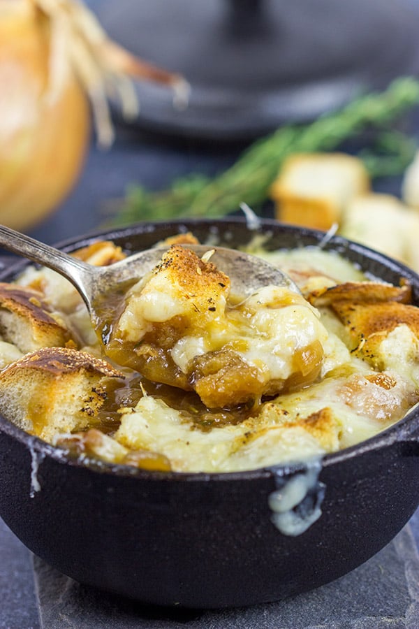 This classic French Onion Soup includes flavorful broth topped with toasted sourdough croutons and plenty of melted cheese! It's the perfect fare for cold winter evenings!