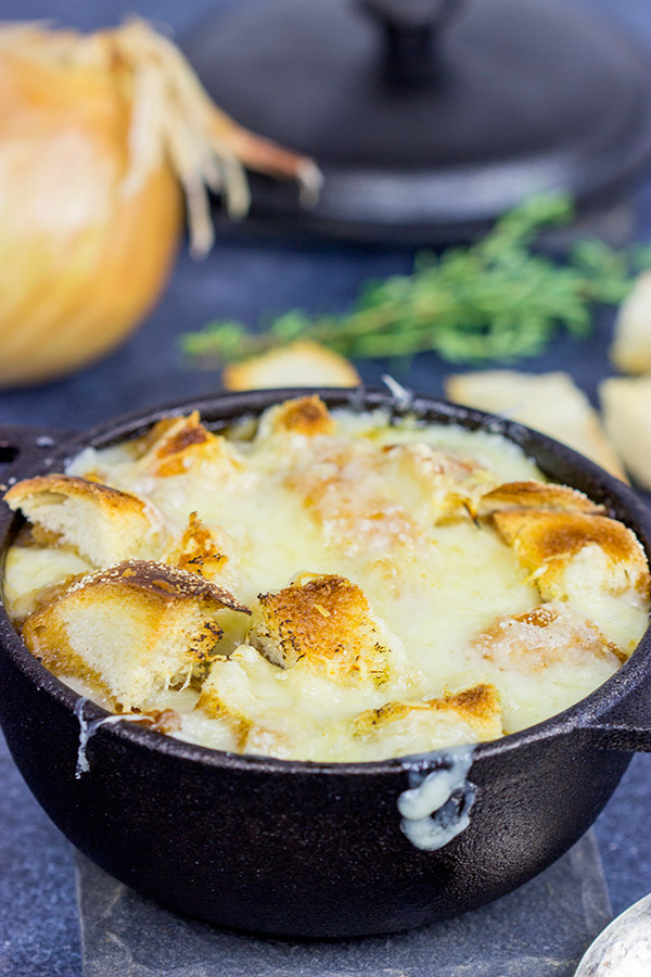 This classic French Onion Soup includes flavorful broth topped with toasted sourdough croutons and plenty of melted cheese!  It's the perfect fare for cold winter evenings!