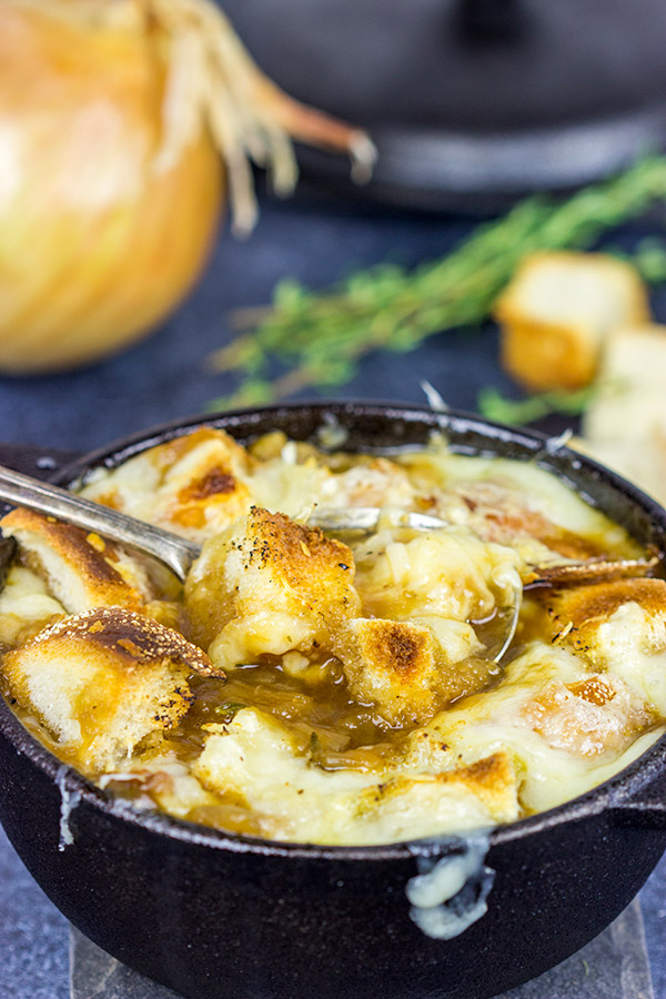 This classic French Onion Soup includes flavorful broth topped with toasted sourdough croutons and plenty of melted cheese!  It's the perfect fare for cold winter evenings!