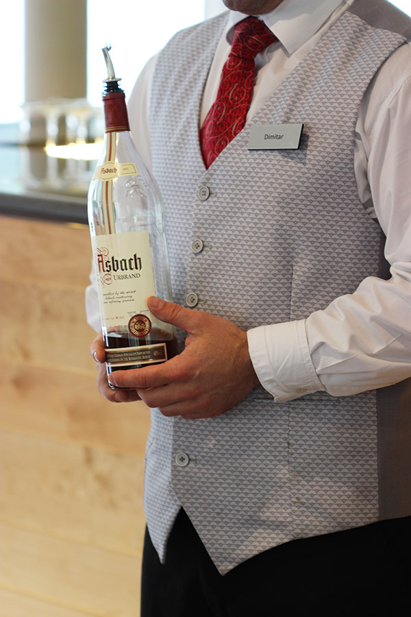 Rüdesheim Coffee is a unique German coffee cocktail featuring flambeed sweetened brandy topped with strong coffee, whipped cream and shaved chocolate.