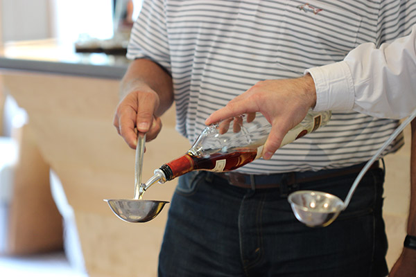 Rüdesheim Coffee is a unique German coffee cocktail featuring flambeed sweetened brandy topped with strong coffee, whipped cream and shaved chocolate.