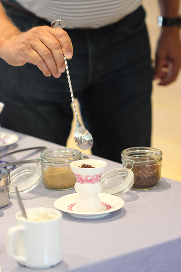 Rüdesheim Coffee is a unique German coffee cocktail featuring flambeed sweetened brandy topped with strong coffee, whipped cream and shaved chocolate.