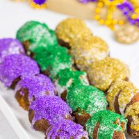 Let the good times roll with a batch of these Mardi Gras Donut Holes!