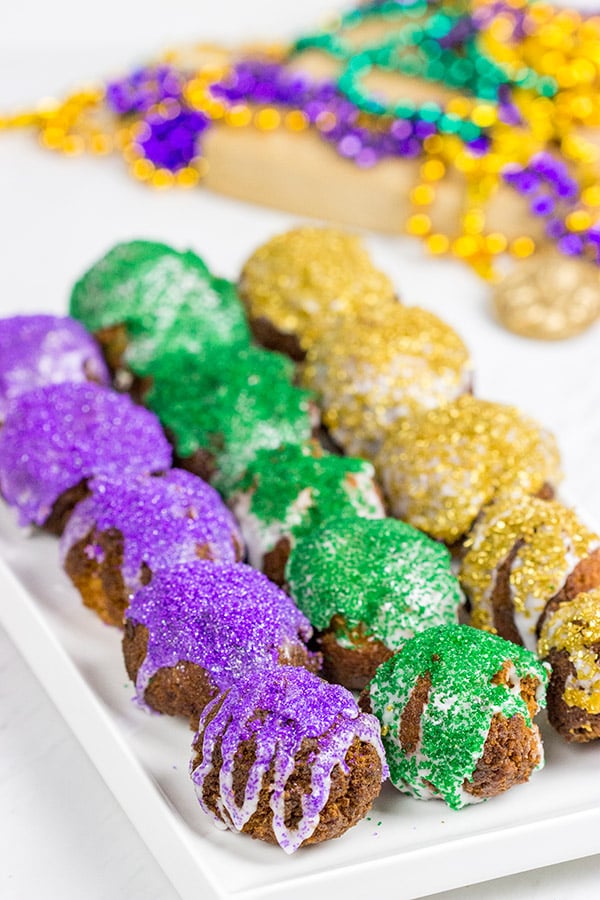 Let the good times roll with a batch of these Mardi Gras Donut Holes!