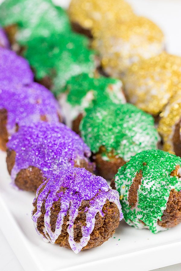 Let the good times roll with a batch of these Mardi Gras Donut Holes!
