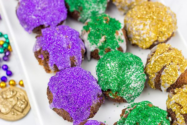 Let the good times roll with a batch of these Mardi Gras Donut Holes!