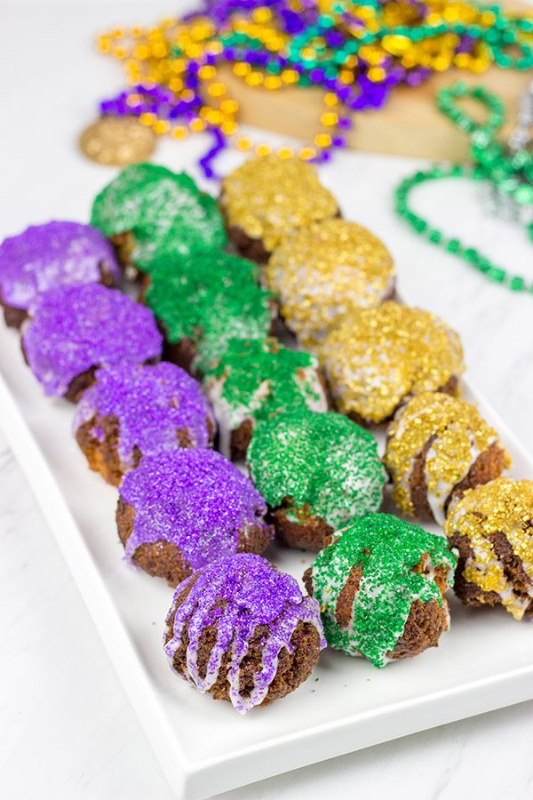 Let the good times roll with a batch of these Mardi Gras Donut Holes!