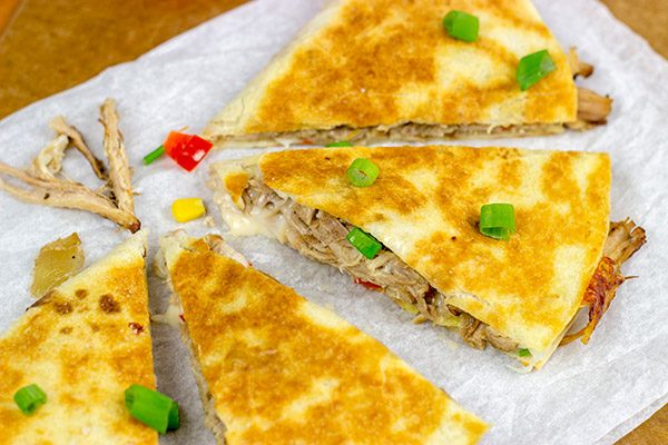 Melty cheese.  Shredded carnitas.  Buttery tortillas.  These Slow Cooker Carnitas Quesadillas make for one heck of a tasty meal!