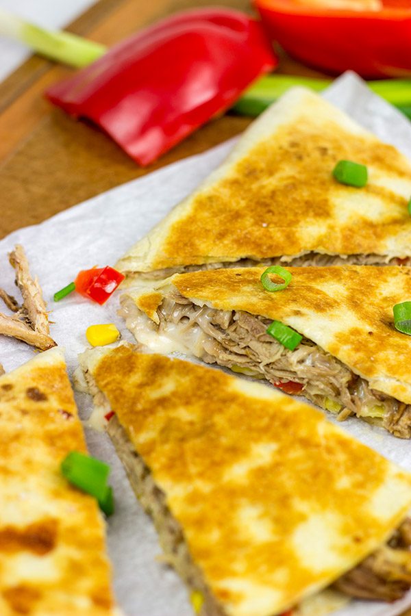 Melty cheese.  Shredded carnitas.  Buttery tortillas.  These Slow Cooker Carnitas Quesadillas make for one heck of a tasty meal!