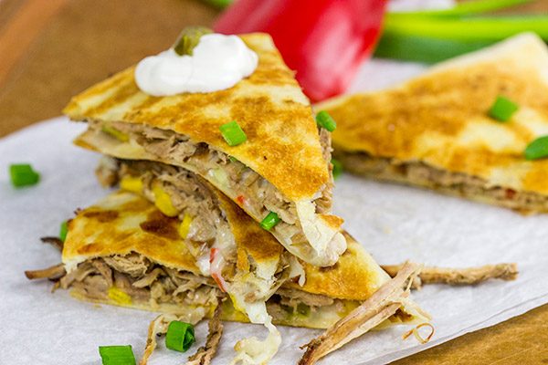 Melty cheese.  Shredded carnitas.  Buttery tortillas.  These Slow Cooker Carnitas Quesadillas make for one heck of a tasty meal!