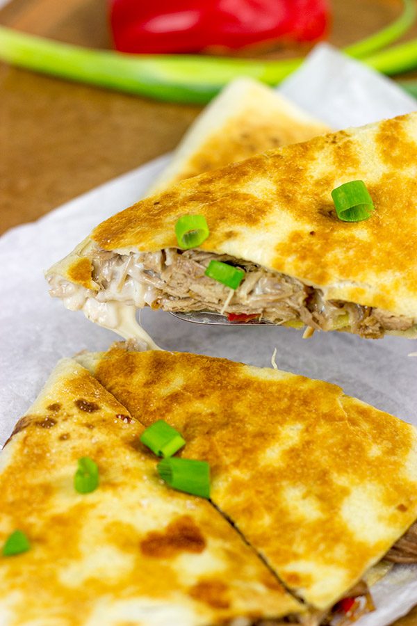 Melty cheese.  Shredded carnitas.  Buttery tortillas.  These Slow Cooker Carnitas Quesadillas make for one heck of a tasty meal!