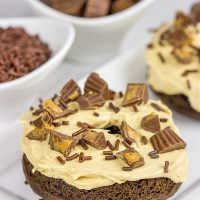 Who said donuts are reserved for breakfast only? These Baked Chocolate Peanut Butter Donuts make for a tasty dessert...or afternoon snack!