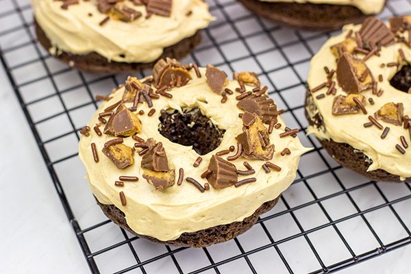 Who said donuts are reserved for breakfast only?  These Baked Chocolate Peanut Butter Donuts make for a tasty dessert...or afternoon snack!