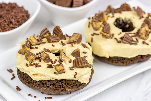 Who said donuts are reserved for breakfast only?  These Baked Chocolate Peanut Butter Donuts make for a tasty dessert...or afternoon snack!