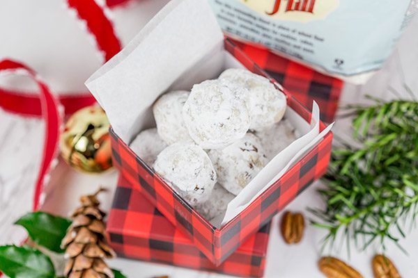 Packed with chopped pecans and rolled in powdered sugar, these Gluten Free Vanilla Pecan Snowball Cookies are one of my all-time favorite holiday cookies!