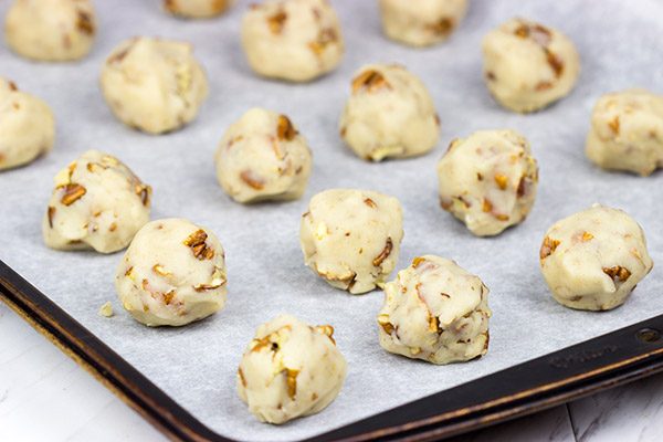 Packed with chopped pecans and rolled in powdered sugar, these Gluten Free Vanilla Pecan Snowball Cookies are one of my all-time favorite holiday cookies!
