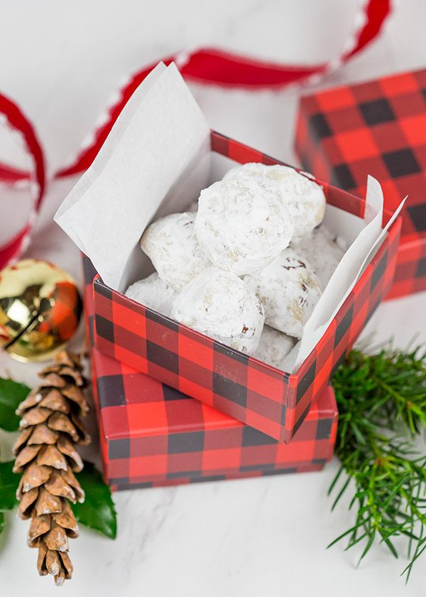 Packed with chopped pecans and rolled in powdered sugar, these Gluten Free Vanilla Pecan Snowball Cookies are one of my all-time favorite holiday cookies!