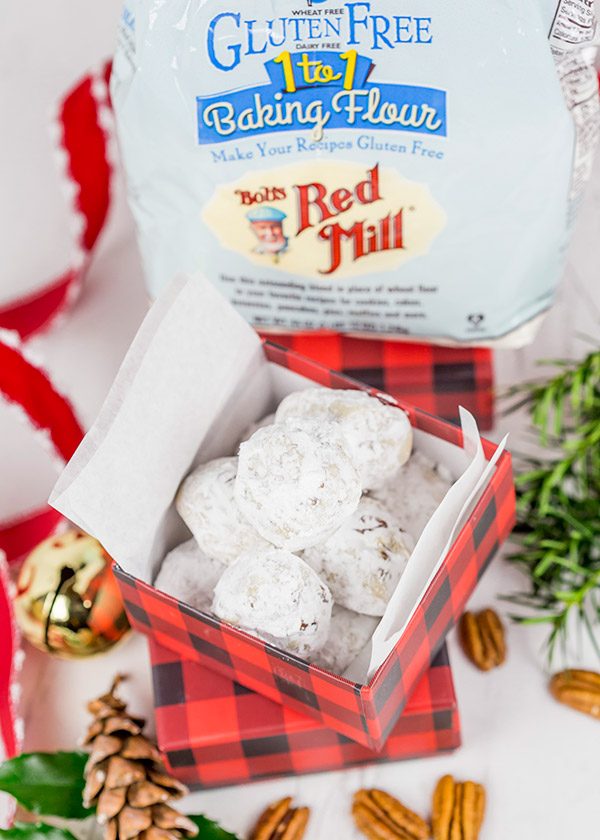 Packed with chopped pecans and rolled in powdered sugar, these Gluten Free Vanilla Pecan Snowball Cookies are one of my all-time favorite holiday cookies!