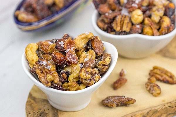 Looking for a fun and unique holiday appetizer? These Maple Glazed Mixed Nuts with Candied Bacon are salty, sweet and delicious!