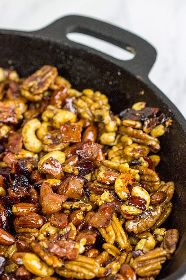 Looking for a fun and unique holiday appetizer? These Maple Glazed Mixed Nuts with Candied Bacon are salty, sweet and delicious!