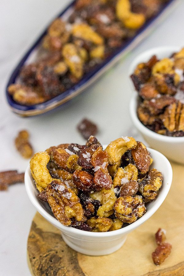 Looking for a fun and unique holiday appetizer? These Maple Glazed Mixed Nuts with Candied Bacon are salty, sweet and delicious!