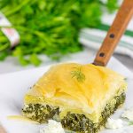 Spanakopita is a classic Greek recipe featuring layers of flaky dough stuffed with spinach and feta cheese...and it's delicious!
