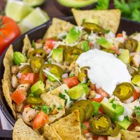 These Cast Iron Skillet Nachos are the perfect snack to serve while watching buzzer beaters in the NCAA Tourney!
